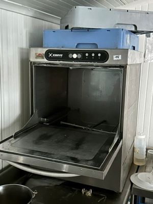 a stove that is in the middle of a kitchen