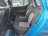 a small blue car with two seats in the back