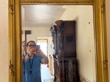 a man taking a picture of himself in a mirror