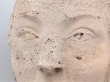 a close up of a statue of a woman ' s face