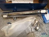 a blue box with a silver and white toothbrush in it
