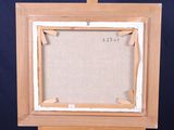 an old picture frame with a picture hanging on a wooden easel