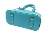 blue leather suitcase with handles on a white background