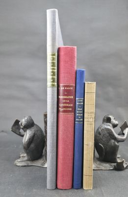 three books that are sitting next to each other on a table