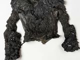 an image of a black top with sequins on it