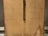 a piece of wood that has a handle on it
