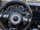 a close up of a steering wheel and dashboard of a car