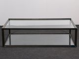 an image of a glass coffee table on a carpeted floor