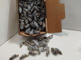 a cardboard box full of batteries on a white table