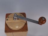 a wooden box with a metal handle on it