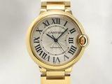 an image of a gold wrist watch with roman numerals on the dial