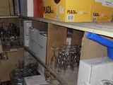 many boxes of wine glasses on the shelves in the room