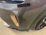 a close up of a car ' s bumper with a sticker on it