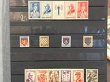 a picture of a person holding a book with stamps on it