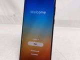a close up of a phone with a welcome screen on it