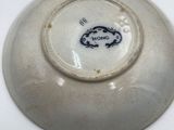 a white plate with a blue design on it