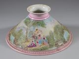 a pink and white vase with a painting on it