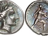 a close up of a coin with an image of a woman on it