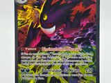 a close up of a pokemon card on a white surface