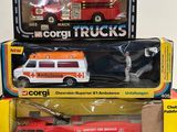 three toy trucks that are sitting on top of each other