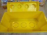 a yellow toy box that has a bunch of legos inside of it