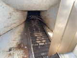 a dirty floor in the back of a truck