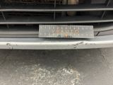 a close up of a car ' s grille with a sticker on it