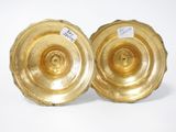 pair of gold plated candlestick holders with labels on them