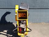 a yellow fire hydrant sitting on the side of a building