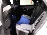 the back seat of a car with a blue seat cushion