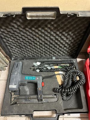 a tool in a case with a cord in it