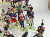 many figurines of different colors and sizes on display