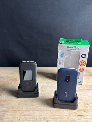 two cell phones sitting next to each other on a table
