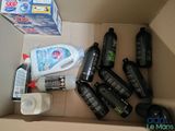 a cardboard box filled with different types of cleaning products