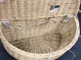 a wicker basket that has a handle on it