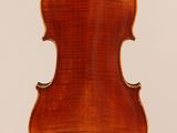 an old violin with a wooden back and a long neck