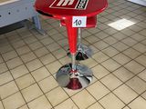 a red table with a number on it in a room