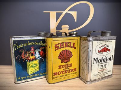 three tins that are sitting on a table