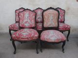 four chairs that are sitting next to each other