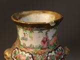 a vase that has been decorated with flowers on it
