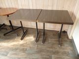 two tables that are next to each other on the floor