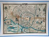 an old map of the city of tokyo with a blue border around it