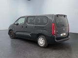 the black van is parked in the empty room of the building