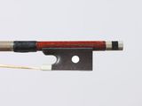 a bow that is attached to a string with a piece of wood