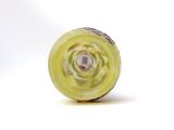 a close up picture of a yellow object on a white surface