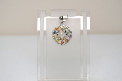 a picture of a necklace with a flower design on it