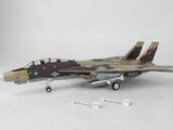 a model of a fighter jet on a white surface