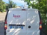 a white van that is parked on the side of the road