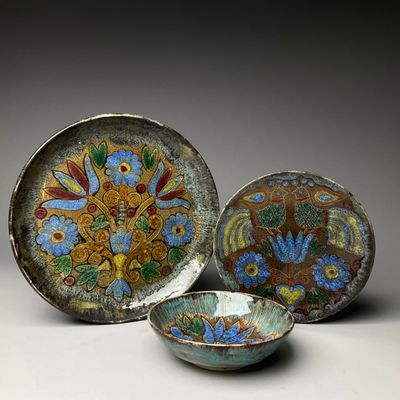 three bowls and a bowl are sitting on a table