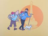 two people with backpacks and a dog on a leash